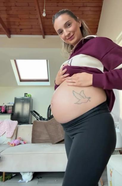 Pregnant woman showing her baby bump.