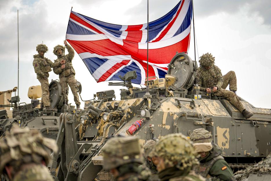 British soldiers display the Union Jack on a military vehicle during a NATO exercise.