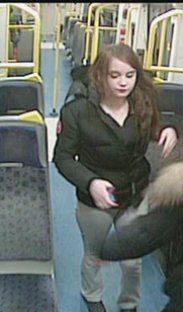 Surveillance image of a teenage girl on a train.