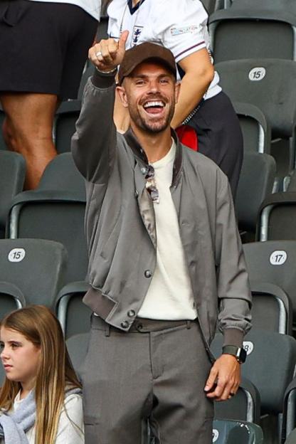 Jordan Henderson giving a thumbs up from the stands.