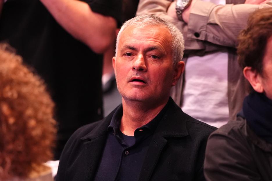 Jose Mourinho in the crowd at a UFC event.