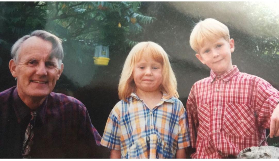 Photo of a grandfather with his granddaughter and grandson.