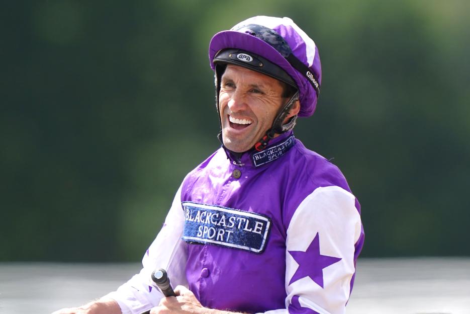 Jockey Neil Callan smiling after a race win.