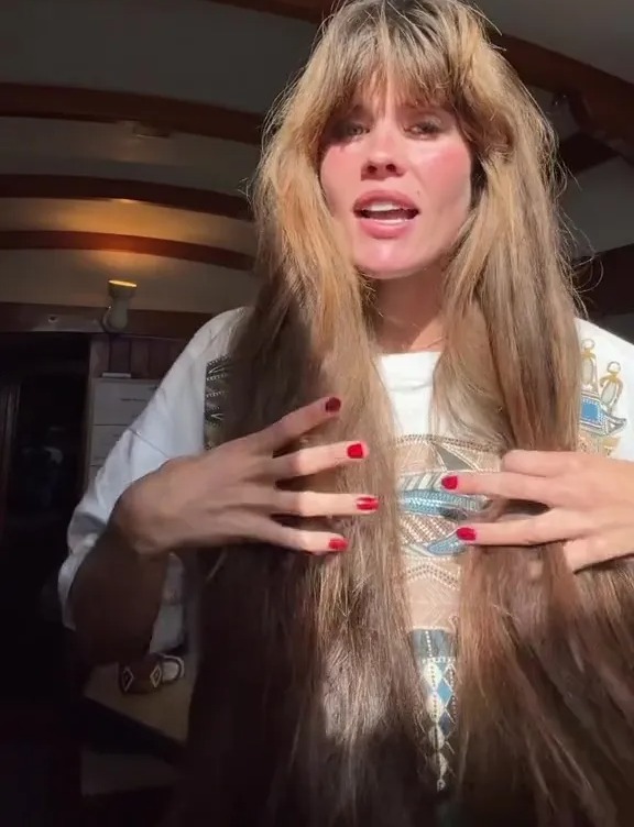 Woman with long hair showing her hair care routine.