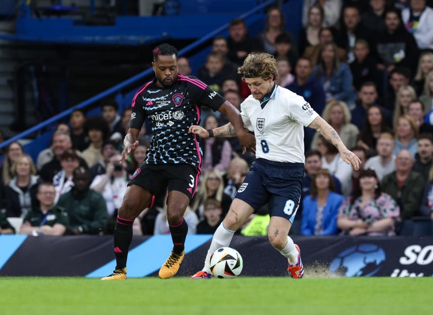 Patrice Evra and Tom Grennan playing soccer at Soccer Aid for UNICEF.