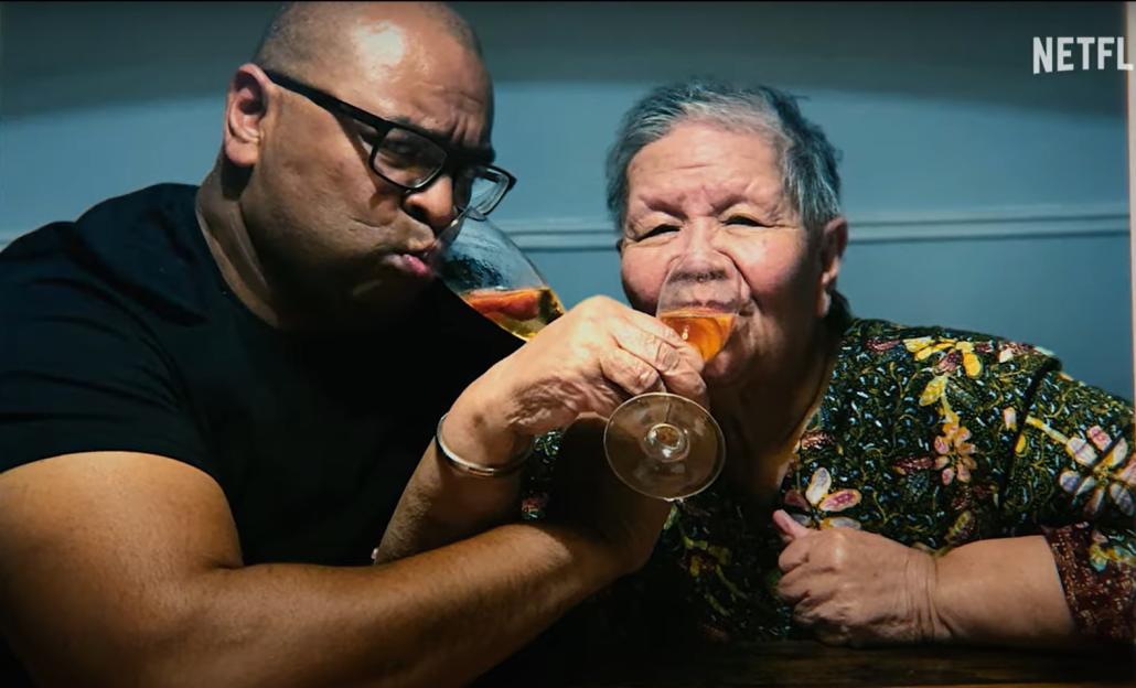 A man and woman toasting with champagne flutes.