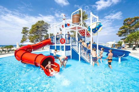 Children playing in a water park.