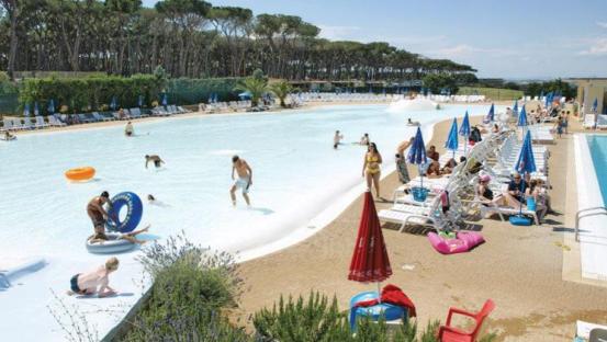 People enjoying a wave pool at a campsite in Rome.