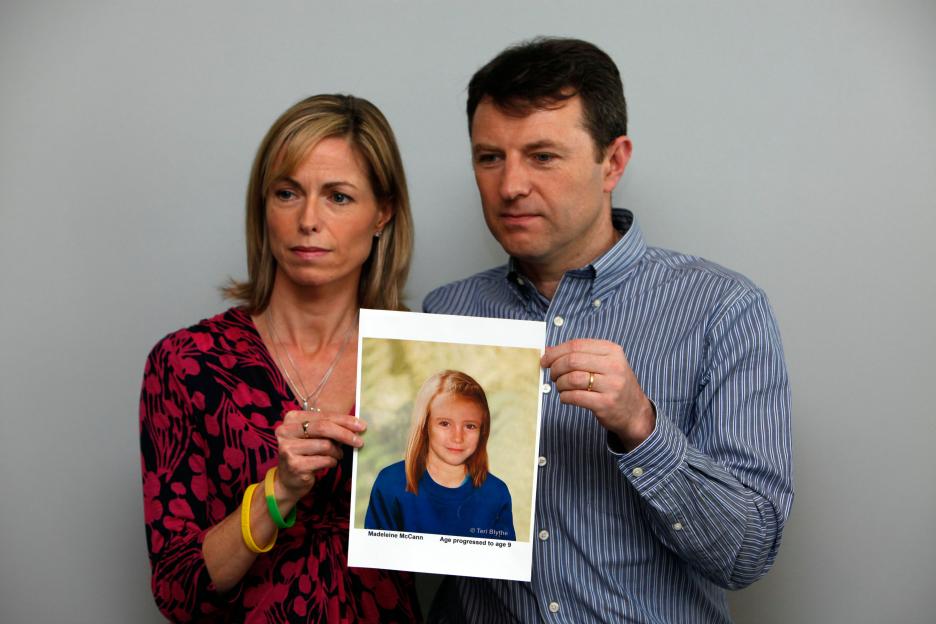 Kate and Gerry McCann holding a photo of their missing daughter, Madeleine.