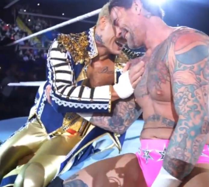 CM Punk and Cody Rhodes embracing.