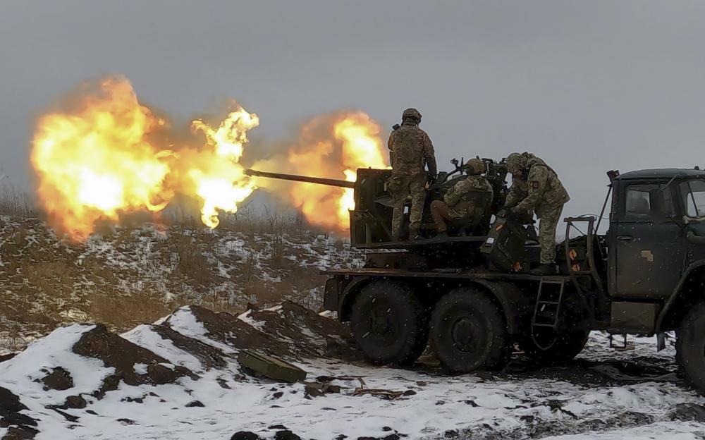 Ukrainian soldiers firing an anti-aircraft gun near Bakhmut.