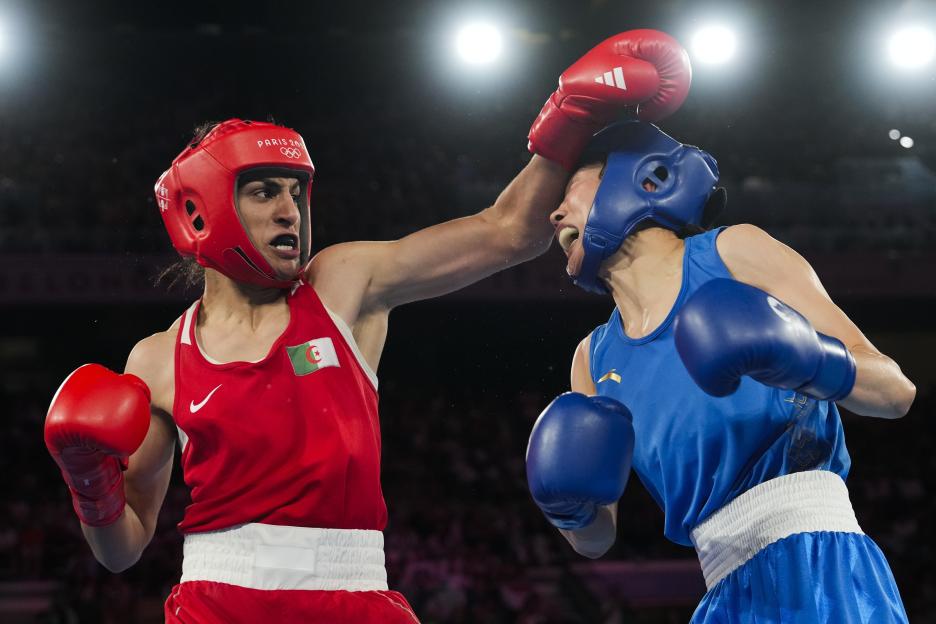 Two female boxers competing in a match.