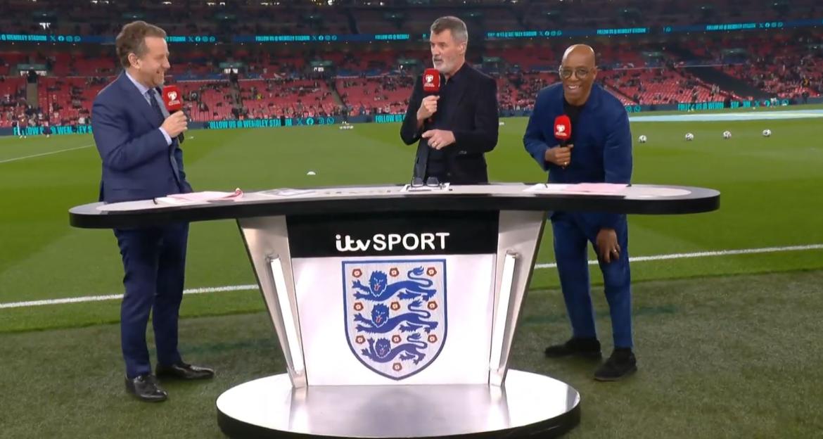 Three sportscasters at a soccer field, standing behind a desk with the itv Sport logo and the English national team crest.