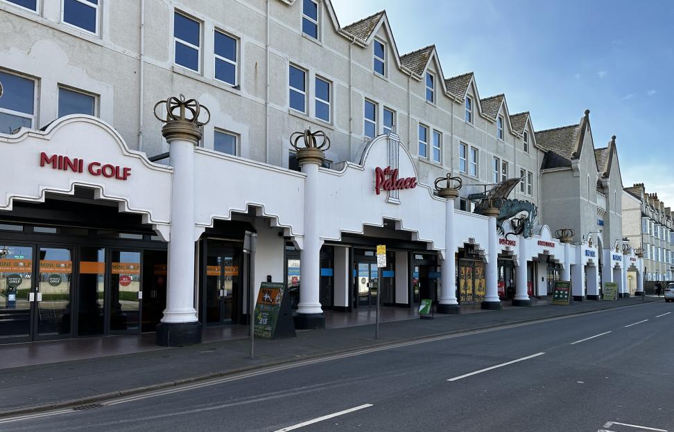 The Palace Fun Centre in Rhyl, Wales, showing mini golf, arcades, and other attractions.