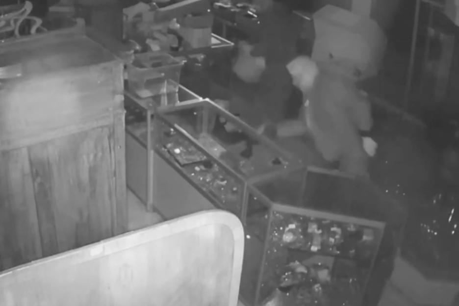 CCTV footage of burglars stealing valuables from an auction house.