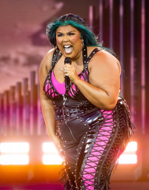 Lizzo performing on stage.