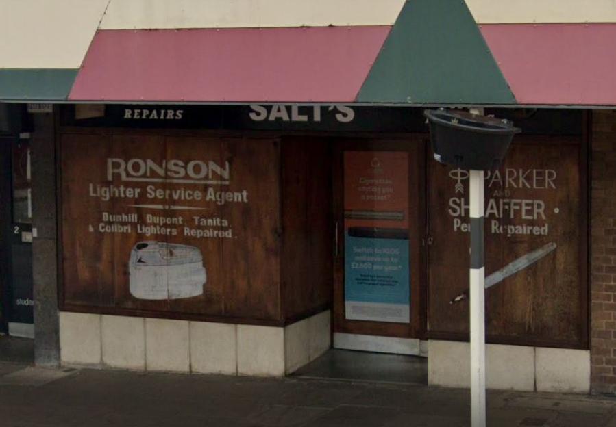 Photo of Salt's, a 109-year-old retailer closing its doors; the storefront shows signs advertising Ronson lighter repair and Parker & Sheaffer pen repair.