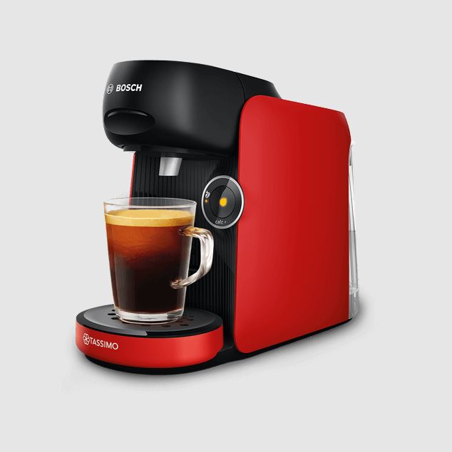 Red Tassimo coffee machine brewing a cup of coffee.