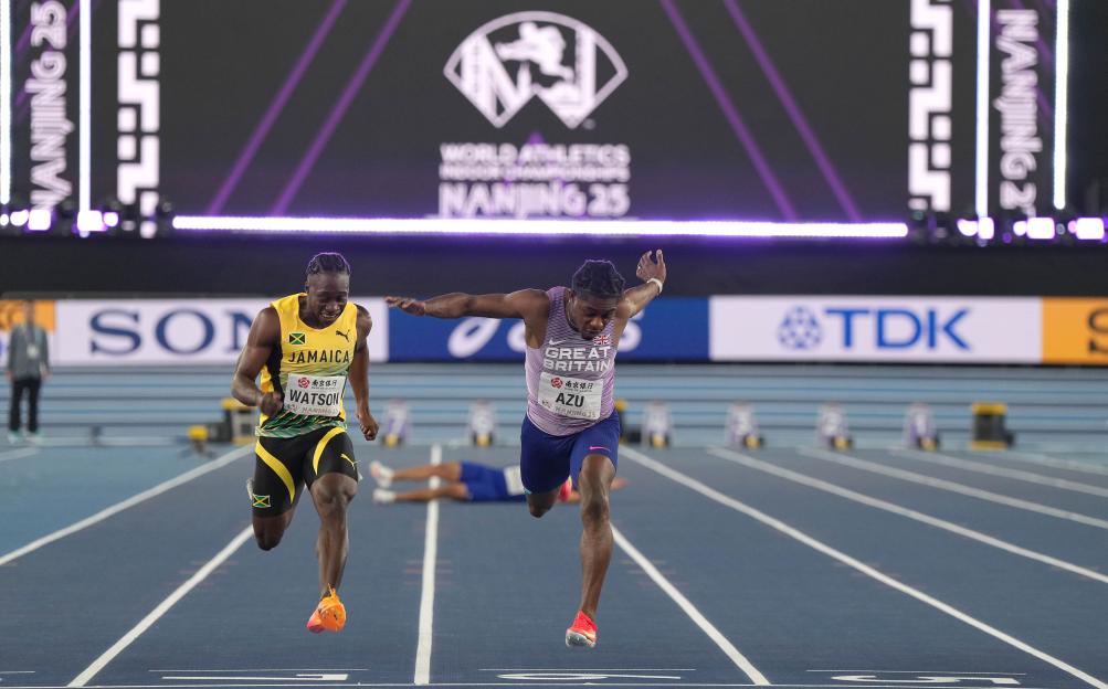 Jeremiah Azu of Great Britain and a Jamaican runner competing in the men's 60m final.