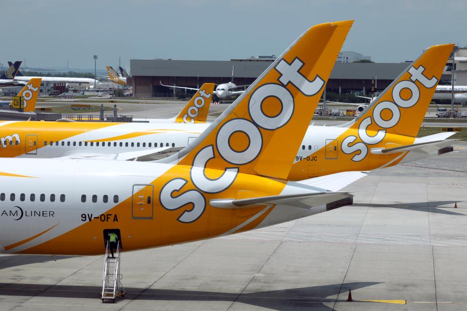 Scoot airplanes on tarmac.