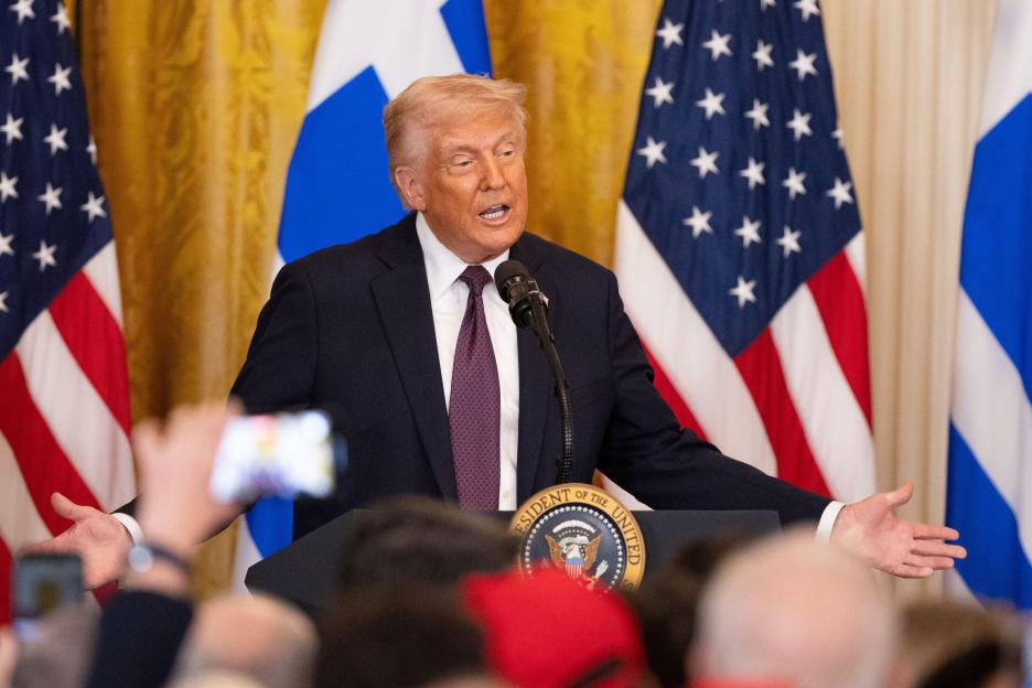 President Trump speaking at a podium.