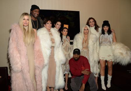 Khloe Kardashian, Lamar Odom, Kris Jenner, Kendall Jenner, Kourtney Kardashian, Kanye West, Kim Kardashian West, Caitlyn Jenner, and Kylie Jenner at Kanye West's Yeezy Season 3 show.
