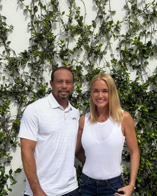 Tiger Woods and Vanessa Trump posing together.