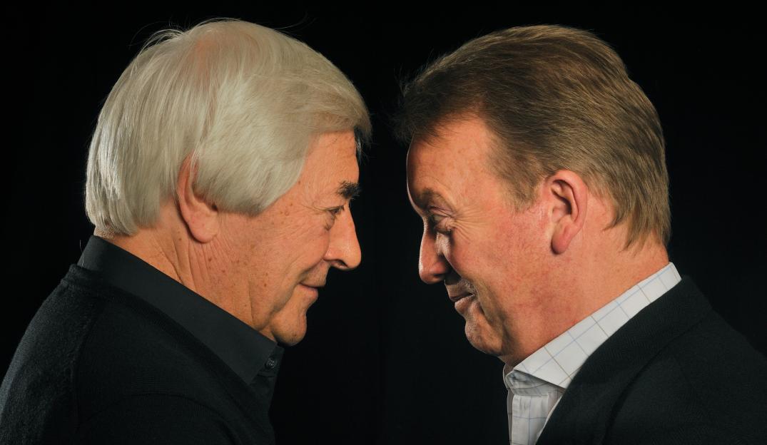 Frank Warren and Colin Hart in profile, facing each other.