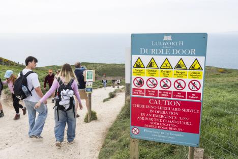 Path to Durdle Door with safety sign.
