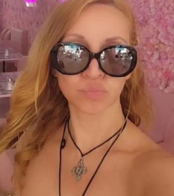 Portrait of Tsvetanka Doncheva wearing sunglasses and a necklace.