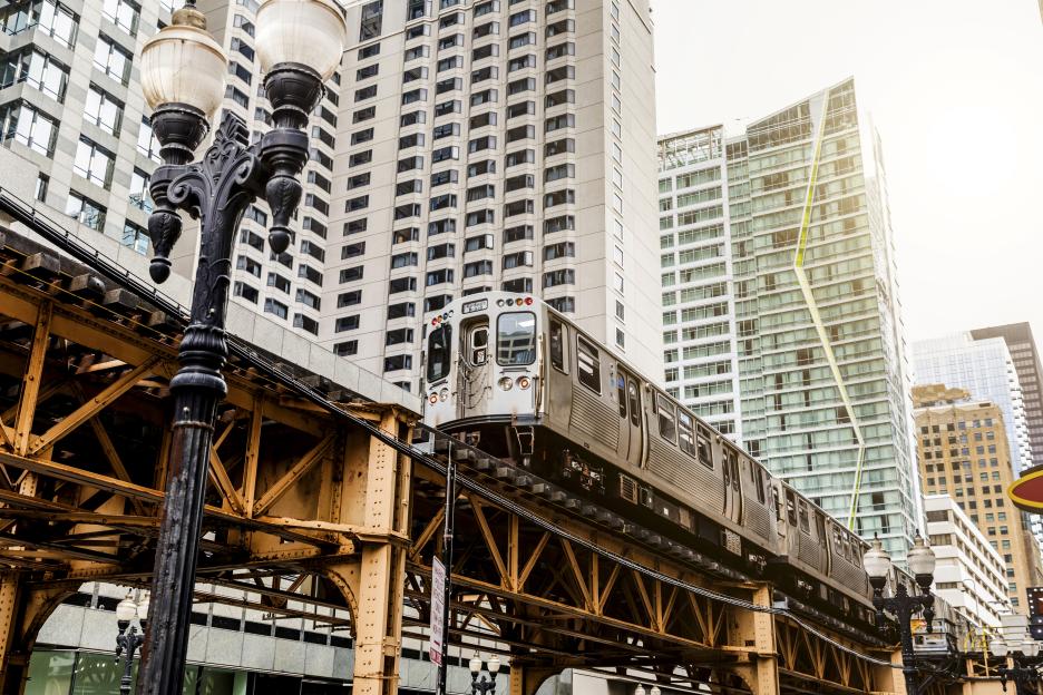 Elevated train passing skyscrapers in Chicago.