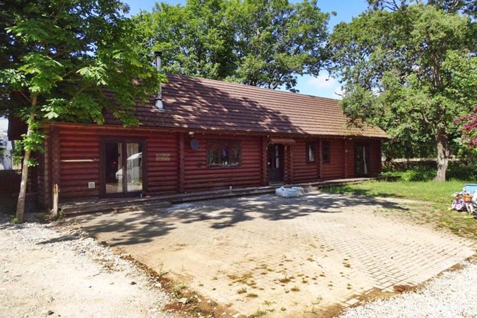 Picturesque three-bedroom log cabin in seaside town could be yours for just £20,000 – but there’s a VERY annoying catch