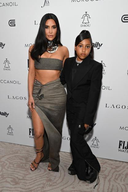 Kim Kardashian and North West at an awards ceremony.