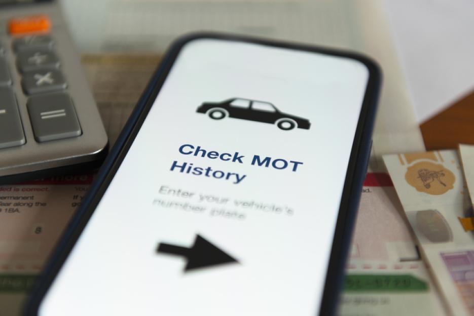 Smartphone displaying a MOT history checker.