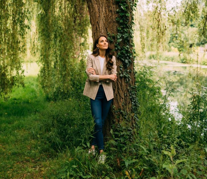 Catherine, Princess of Wales, stands by a tree in Windsor.