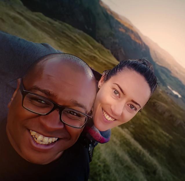 Selfie of Graham Hornigold and Heather Kaniuk in a mountainous landscape.