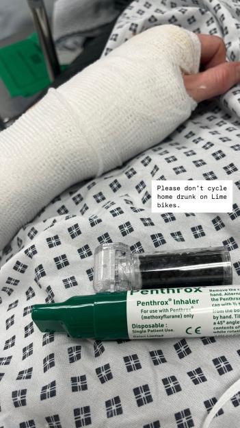 Bandaged arm and pain relief inhaler in hospital.