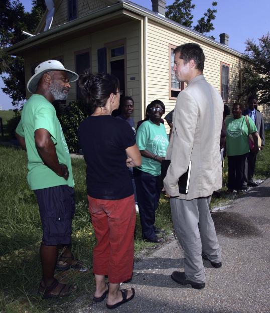 Brad Pitt speaking with residents of Holly Cross in New Orleans about post-hurricane reconstruction.