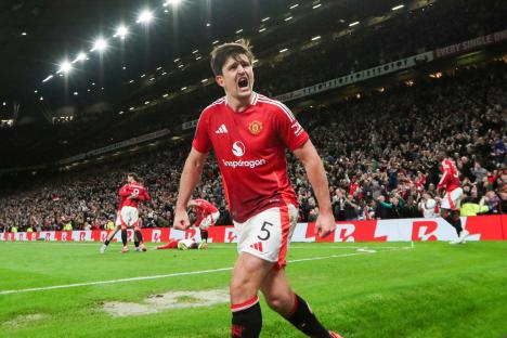 Harry Maguire celebrating a goal at Old Trafford.