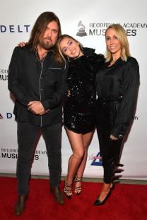 Billy Ray Cyrus, Miley Cyrus, and Tish Cyrus at the MusiCares Person of the Year event.