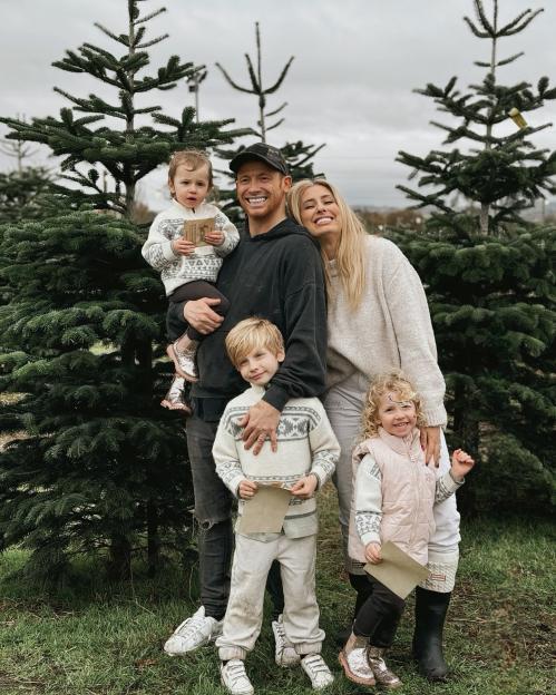 Family choosing a Christmas tree.