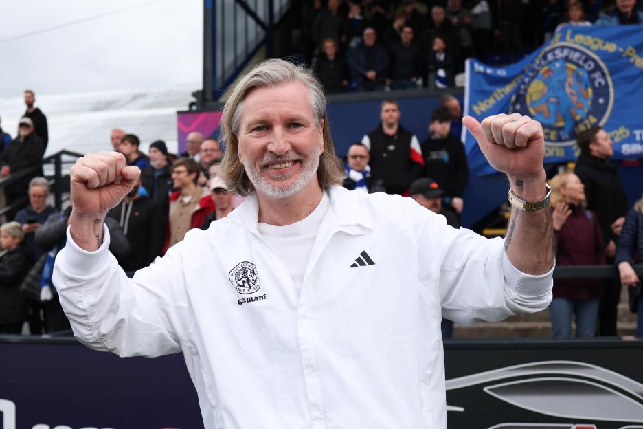 Robbie Savage, Macclesfield manager, celebrates his team's championship win.