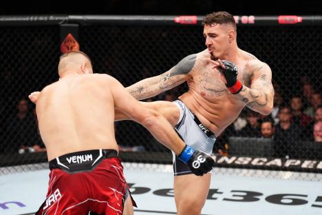 Tom Aspinall kicks Marcin Tybura in a UFC heavyweight fight.