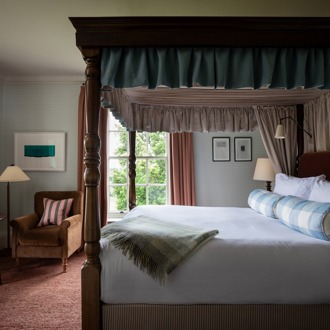 Four-poster bed in a hotel room.