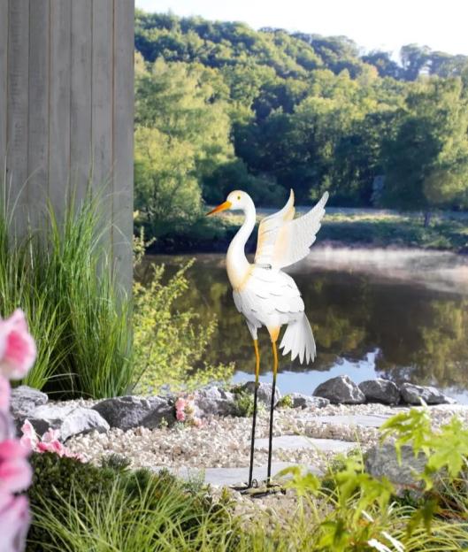 White metal crane garden ornament.