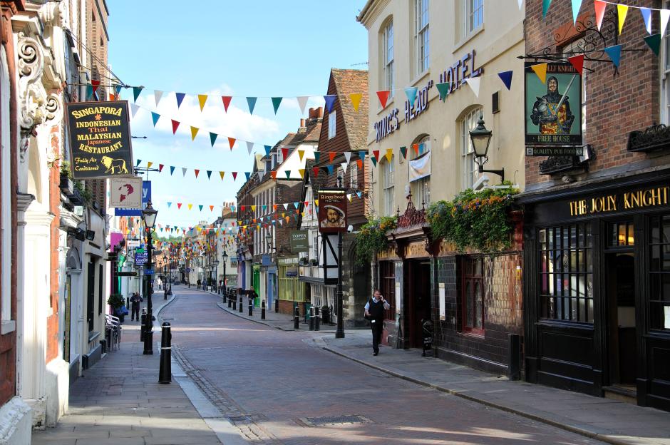 High street in Rochester, Kent with festive flags.