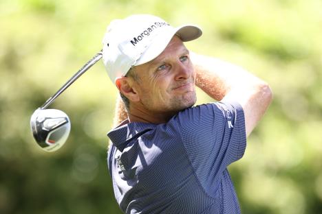 Justin Rose of England playing a golf shot.
