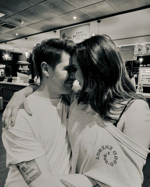 Black and white photo of a couple embracing.