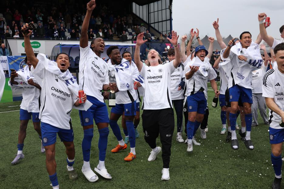 Macclesfield football team celebrating their championship win.