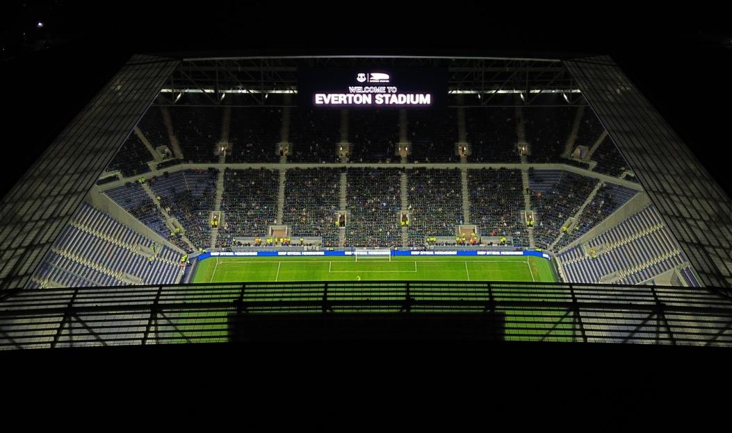 Aerial view of Everton Stadium at night, filled with spectators.